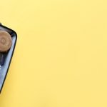 Packed,Suitcase,With,Belongings,On,Yellow,Background,With,Space,For