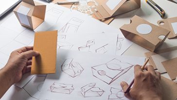 Designer sketching drawing design Brown craft cardboard paper product eco packaging mockup box development template package branding Label . designer studio concept . product, packaging, package, design, designer, template, development, recycle, eco, paper, cardboard, drawing, recycling, pack, branding, sketching, process, mockup, business, creative, packing, art, box, concept, craft, creation, creativity, desk, gift, graphic, imagination, job, label, marketing, office, people, person, plan, pouch, production, professional, project, retail, sketch, style, work, working, workplace