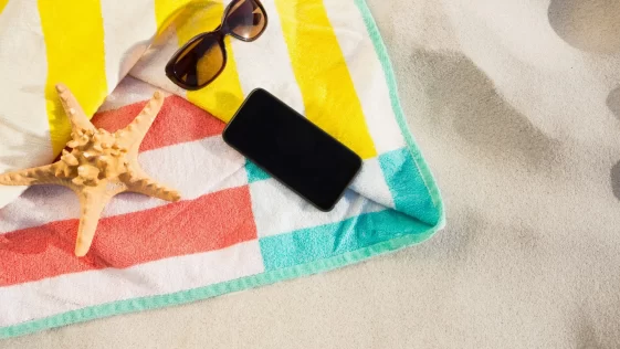 starfish-sunglasses-mobile-phone-kept-beach-blanket