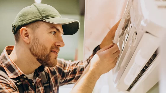 repairman-doing-air-conditioner-service