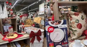 Expositor de artigos de Natal e loiça de mesa numa loja, com almofadas decorativas e produtos em promoção